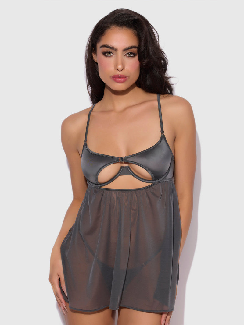A woman models the Frederick's of Hollywood Neev Oil Slick Openable Cup Underwire Babydoll—a sheer, dark gray dress with thin straps and front cutout—against a plain, light background.