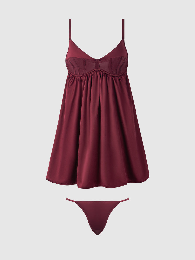 The Petra Satin & Mesh Unlined Corset Cup Babydoll Set by Frederick's of Hollywood features a burgundy satin babydoll with a corset-inspired bra top and matching thong, both displayed against a plain light gray background.