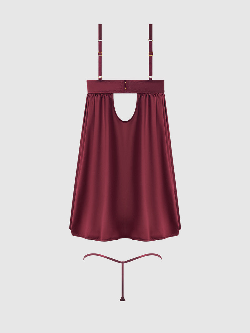 The Petra Satin & Mesh Unlined Corset Cup Babydoll Set by Frederick's of Hollywood features a burgundy flowy top with adjustable straps, front cutout, unlined cups, and includes a matching thong, shown on a plain light background.