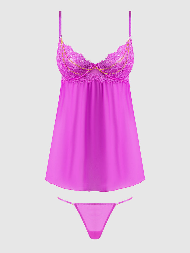 The Arianna Lace & Chains Underwire Babydoll Set by Frederick's of Hollywood features a bright pink lace and satin camisole with push-up cups, thin straps, and matching thong underwear, displayed on a light gray background.