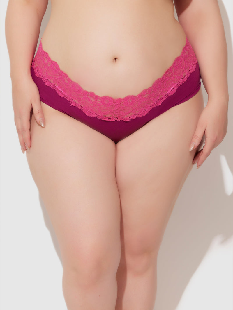 A model wears the Bridget Cotton & Lace Hipster by Frederick's of Hollywood in magenta, shown from midriff to upper thighs against a plain white background.