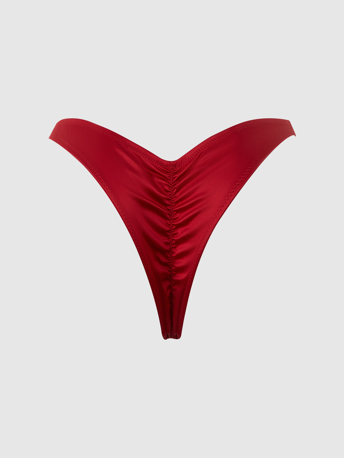 The Petra Crotchless Satin Tanga by Frederick's of Hollywood is a red, high-cut V-shaped tanga with ruched front details, showcased against a plain light gray background.