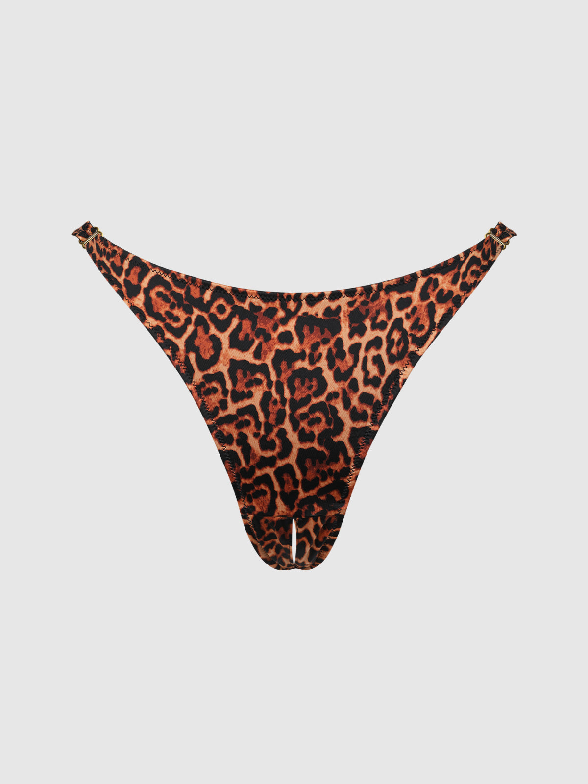 The Frederick's of Hollywood Rising Star Liquid Satin Crotchless Tanga features a bold orange and black leopard print with a high-cut fit, showcased against a plain white background.