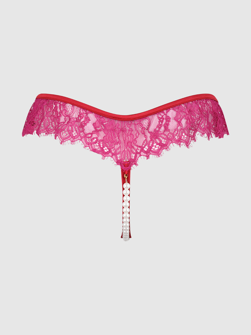 The Rosalind Lace & Pearl Crotchless Thong by Frederick's of Hollywood features bright pink lace, an off-shoulder-style waistband, and a string adorned with pearl accents, shown against a plain light background.