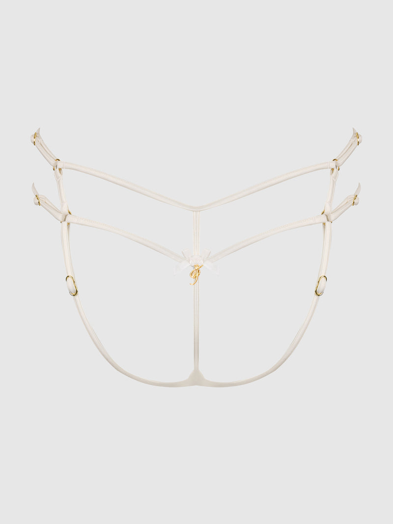 The Delfina Embroidered Backless Cheeky by Frederick's of Hollywood features delicate white strappy details, adjustable gold hardware, a central bow accent, and thin straps for a minimal, decorative look.