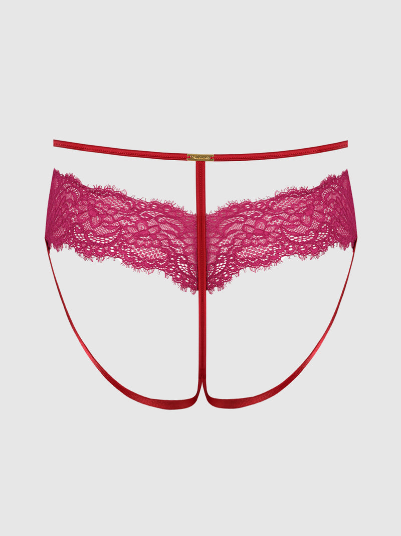 The Rosalind Crotchless Panty by Frederick's of Hollywood features a sheer red lace front and thin red straps in a T-shape design, radiating elegance and sensuality. Set against a plain white background, this alluring lace panty is an irresistible choice for those seeking stylish backless underwear.
