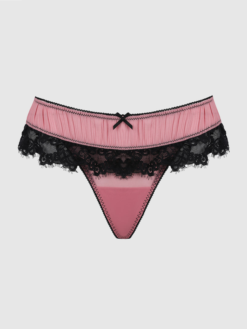 The Esme Pleated Chiffon & Lace Backless Panty by Frederick’s of Hollywood features a pink thong design with black lace trim and a small black bow at the waistband, showcased against a plain white background.