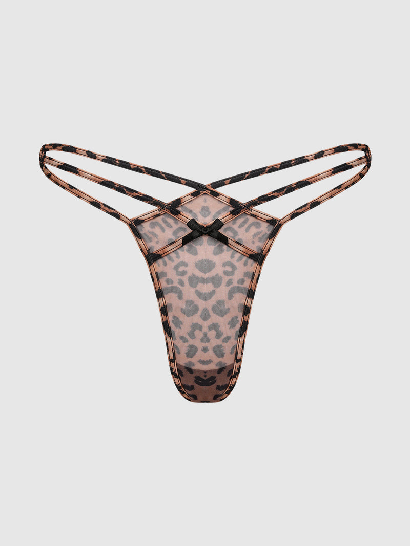 The Kaia Leopard Mesh Strappy & Backless Hipster by Frederick's of Hollywood features a sheer leopard print, double side straps, and a small black bow at the center front, shown on a plain white background.