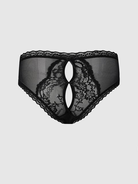 The Frederick’s of Hollywood Daphne Satin & Lace Open Back Hipster is a women’s black lace underwear featuring a sheer mesh front with two oval cut-out designs in the center, intricate lace patterns, and scalloped edges. The product is showcased against a plain light gray background.