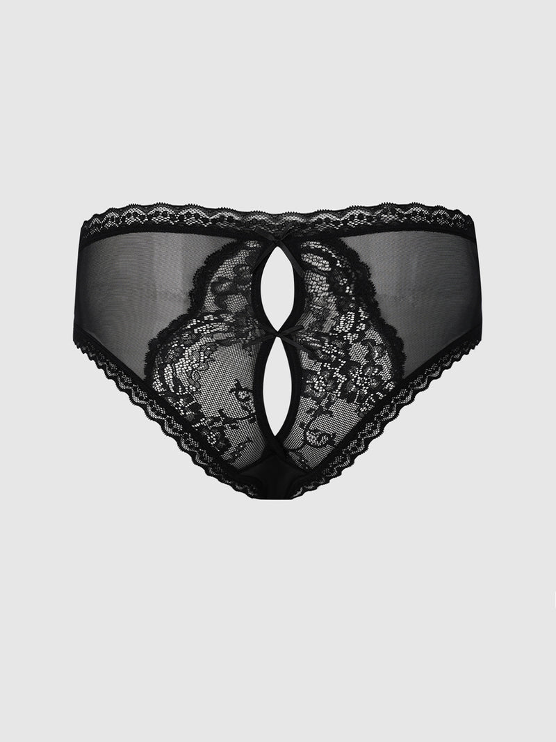 The Frederick’s of Hollywood Daphne Satin & Lace Open Back Hipster is a women’s black lace underwear featuring a sheer mesh front with two oval cut-out designs in the center, intricate lace patterns, and scalloped edges. The product is showcased against a plain light gray background.