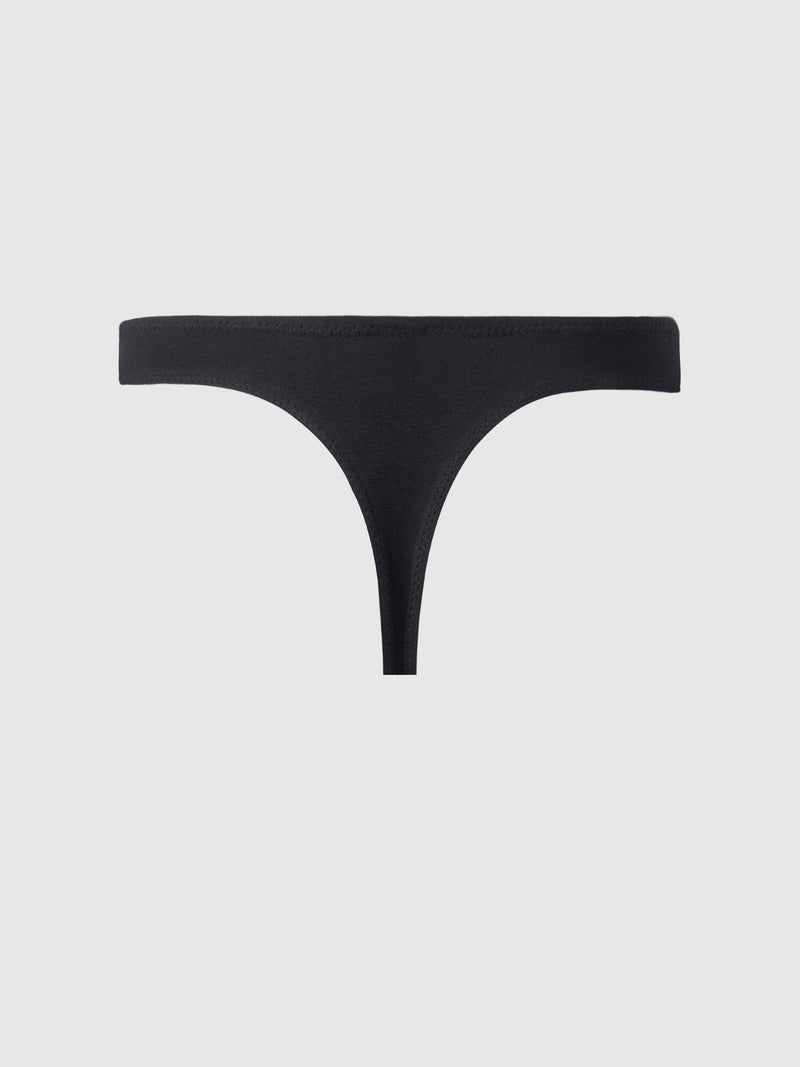 The Bailey Stretch Cotton Tanga by Frederick's of Hollywood is a plain black thong underwear with a minimalist design and cheeky cut, shown on a light gray background.