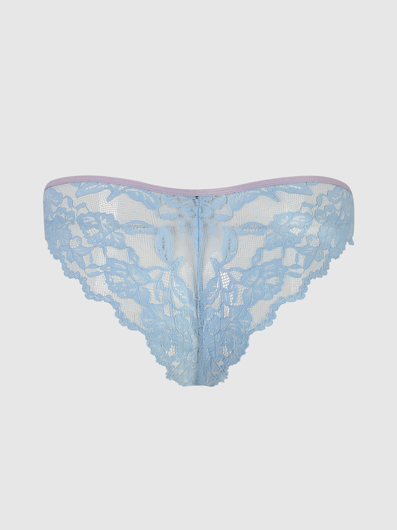The Mabel Lace Up Front Crotchless Tanga by Frederick's of Hollywood features light blue stretch lace with a sheer floral pattern, scalloped edges, and a light pink trimmed waistband. Displayed against a plain white background.