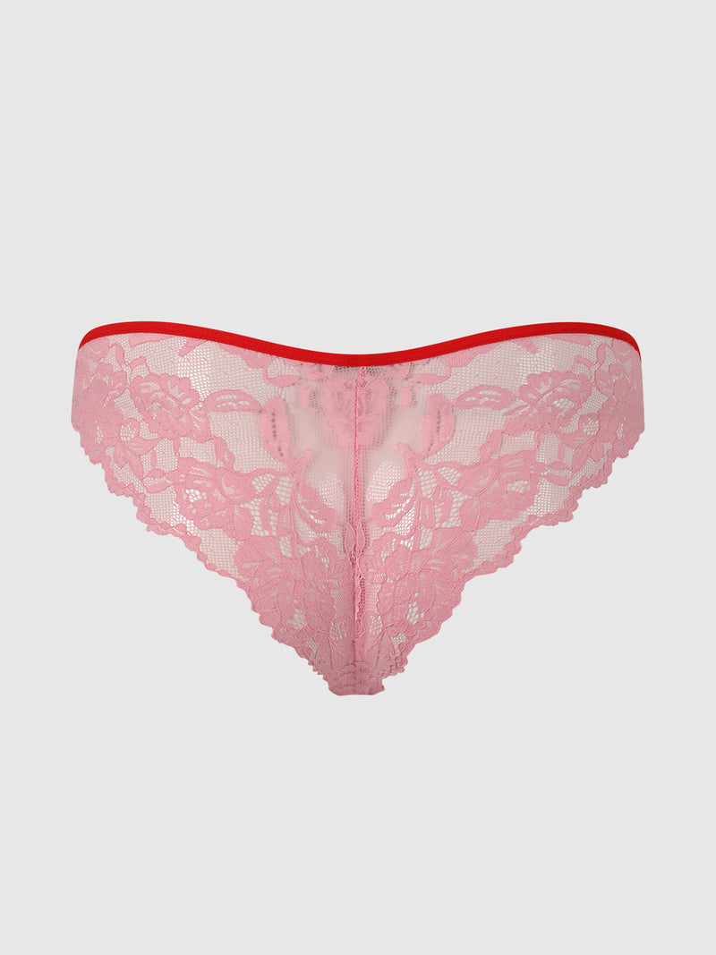 The Mabel Lace Up Front Crotchless Tanga by Frederick's of Hollywood features pink lace, a red elastic waistband, and a playful lace-up front, shown on a plain light gray background.