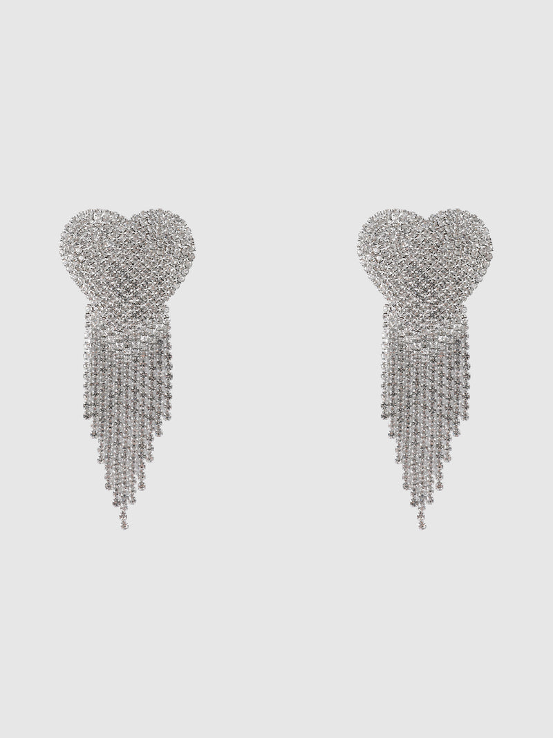 A pair of Ziggy Rhinestone Fringe Heart Pasties by Frederick’s of Hollywood, featuring sparkly silver hearts with cascading rows of rhinestone chains, displayed on a plain white background.