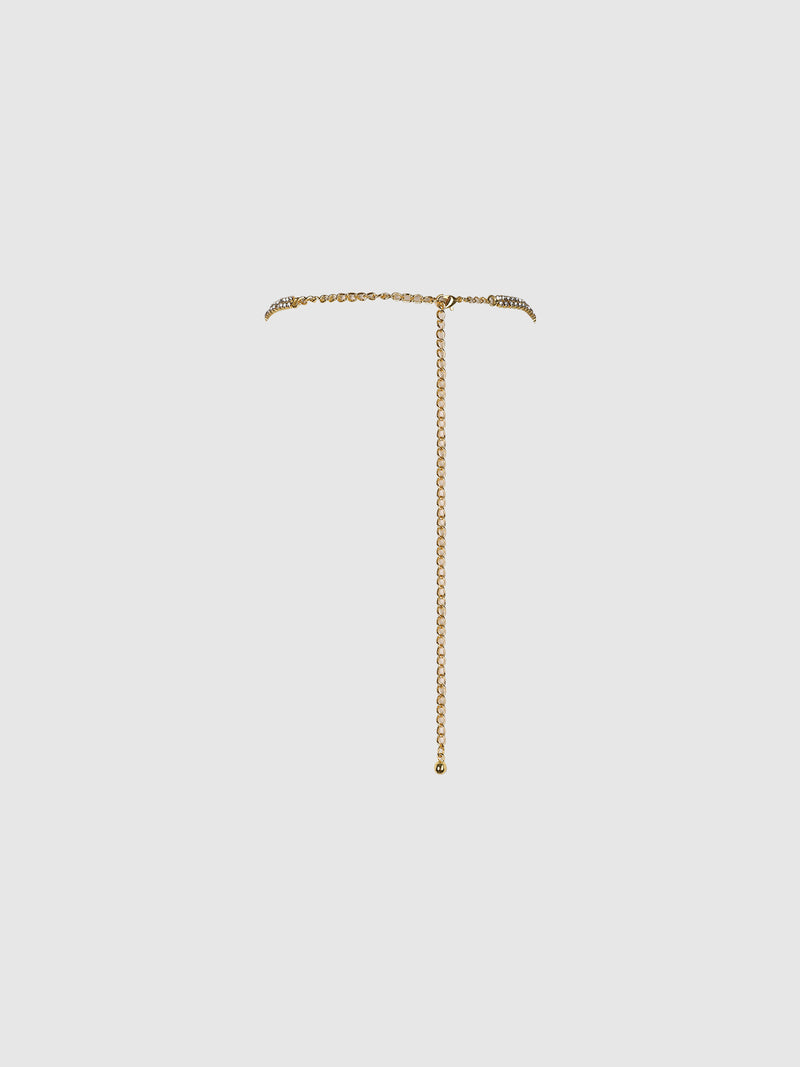 The Ziggy Rhinestone Neck Halter And Pasties by Frederick’s of Hollywood features a delicate design with a thin gold chain that wraps closely around the neck, complemented by a single long vertical drop ending in a small gold bead. The piece is set against a plain, light gray background.