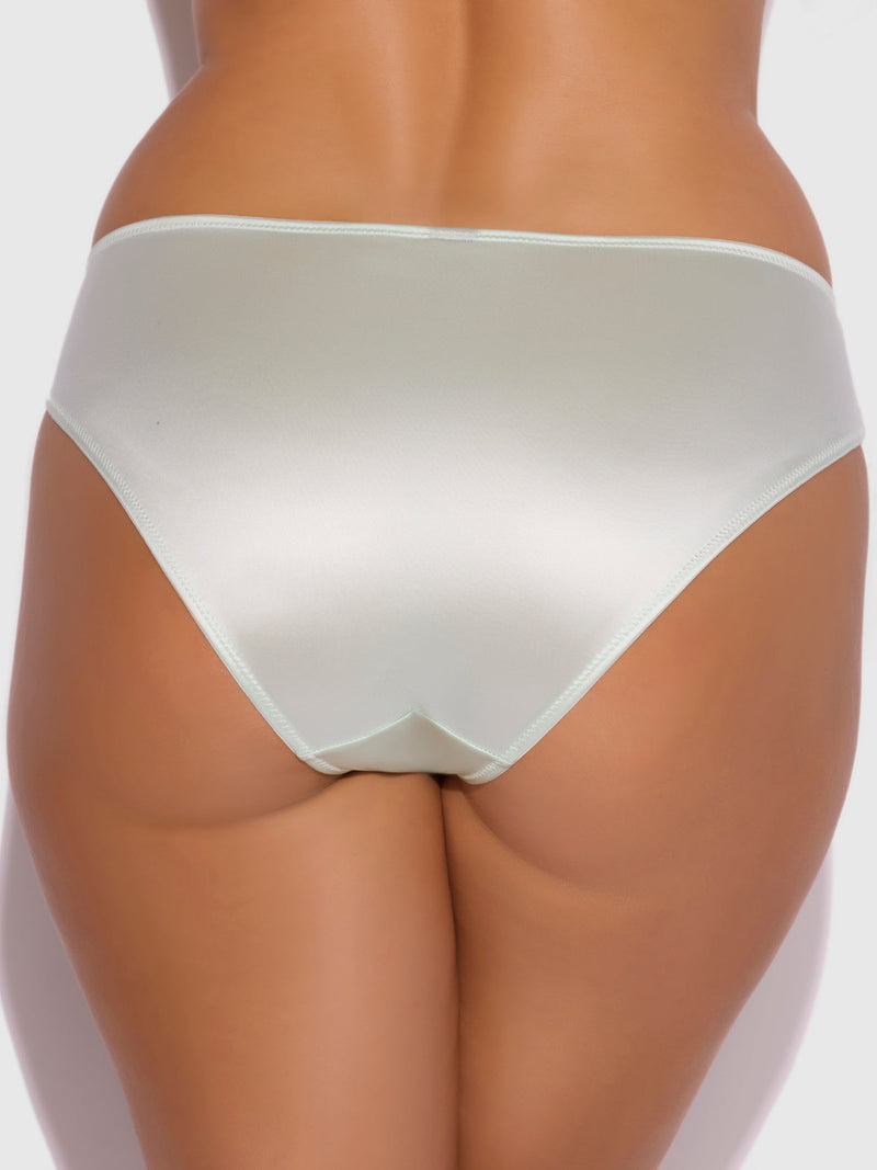 A person photographed from the waist down wears the Frederick's of Hollywood Lexi Liquid Satin Hipster, a light-colored, moderately covered panty with a subtle sheen. The plain background is well-lit.