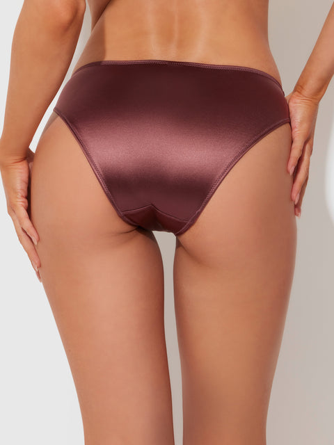 A person is shown from the back, wearing Frederick's of Hollywood Lexi Liquid Satin Hipster bikini bottoms in shiny brown against a plain light background.