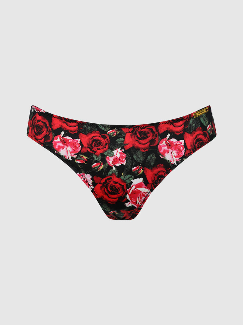 The Lexi Liquid Satin Hipster by Frederick’s of Hollywood is a pair of women’s bikini-style underwear featuring a black background adorned with a vibrant red and pink rose floral pattern.