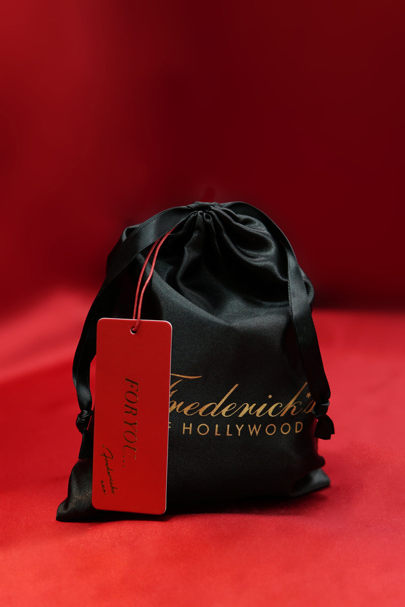 Black drawstring bag with a red tag featuring Frederick's of Hollywood on a red background