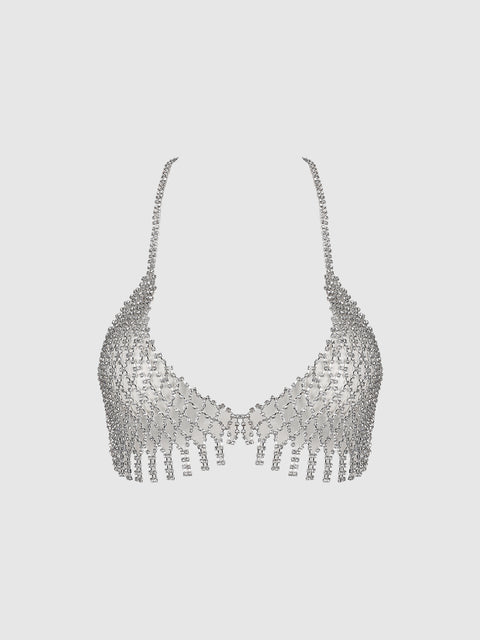 The Ziggy Rhinestone Net Bra by Frederick’s of Hollywood, a shimmering silver bralette adorned with small rhinestones, features chain straps and fringe details along the bottom edge, displayed against a plain white background.