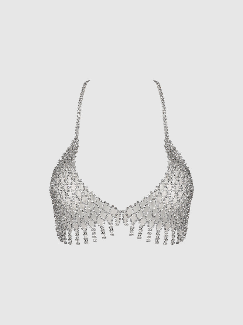 The Ziggy Rhinestone Net Bra by Frederick’s of Hollywood, a shimmering silver bralette adorned with small rhinestones, features chain straps and fringe details along the bottom edge, displayed against a plain white background.