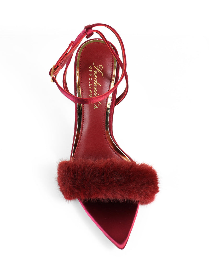 The Aileen Pointed Toe Heel by Frederick's of Hollywood is a red heel with an ankle strap and maroon fur band, featuring an elegant, timeless design and the brand’s signature insole.