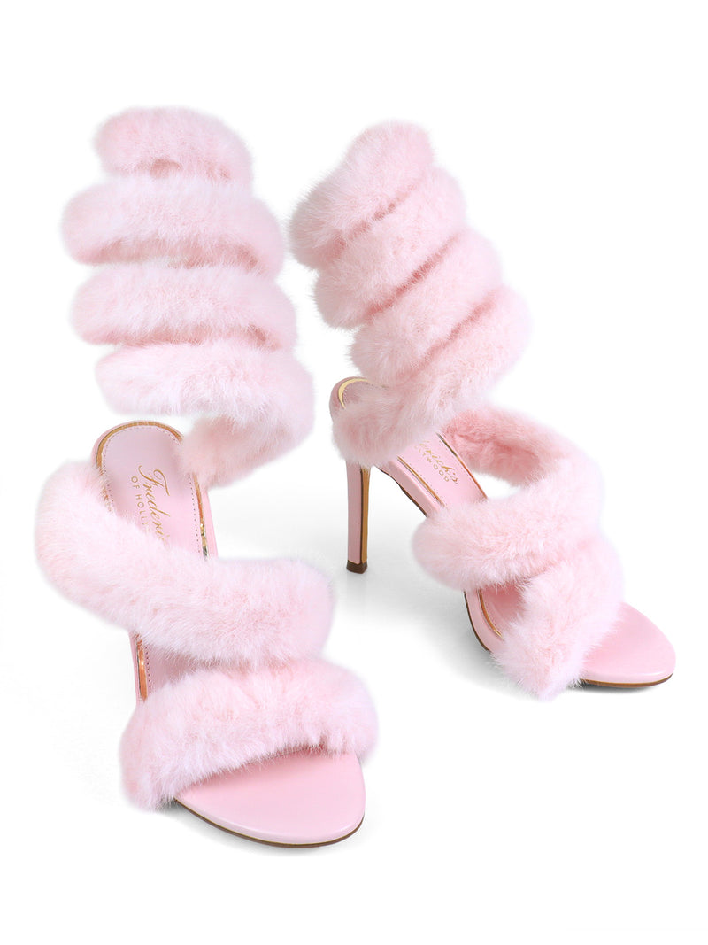 The Allure Fluffy Stiletto Sandal by Frederick's of Hollywood features three fluffy light pink fur straps on each shoe, including an ankle wrap, plus slim stiletto heels and matching pink soles for a glam statement.