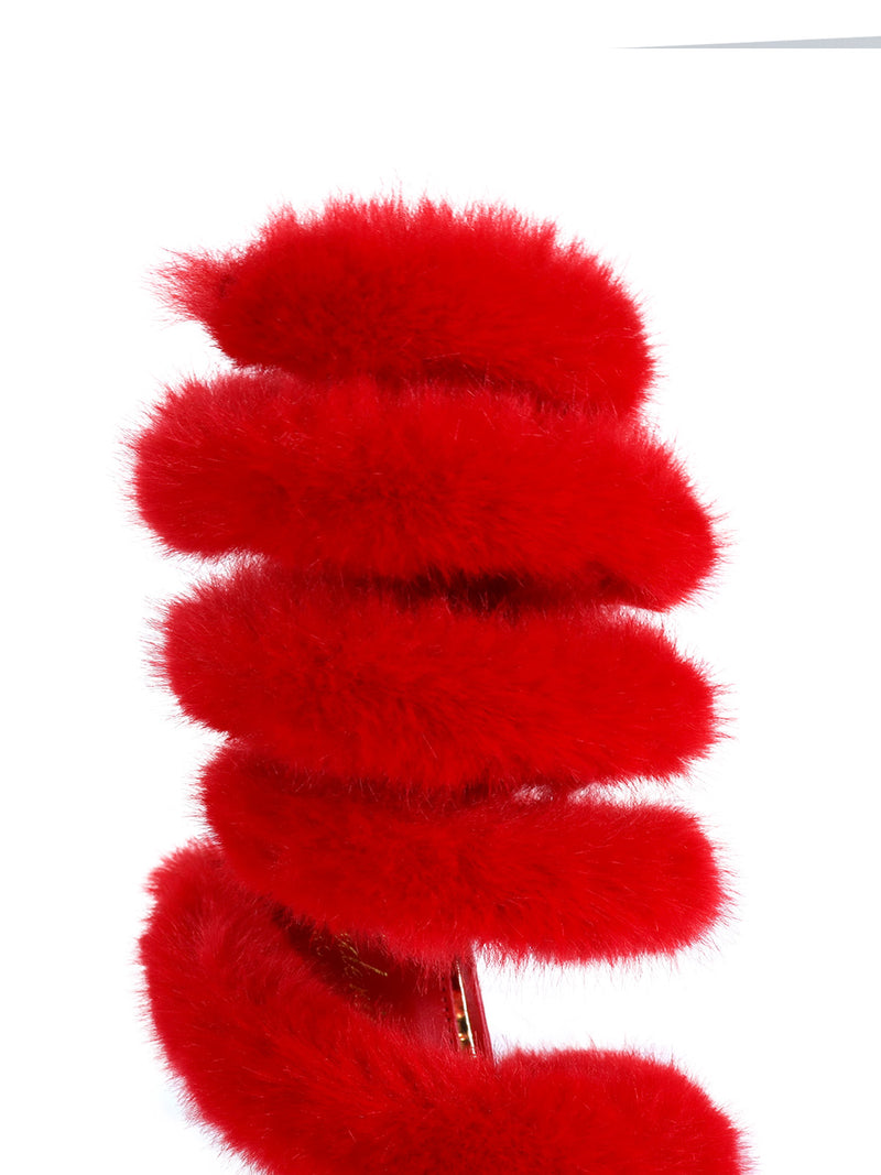 A close-up of the Allure Fluffy Stiletto Sandal by Frederick's of Hollywood, featuring bright red, soft, circular accents stacked vertically against a white background for a glamorous effect.