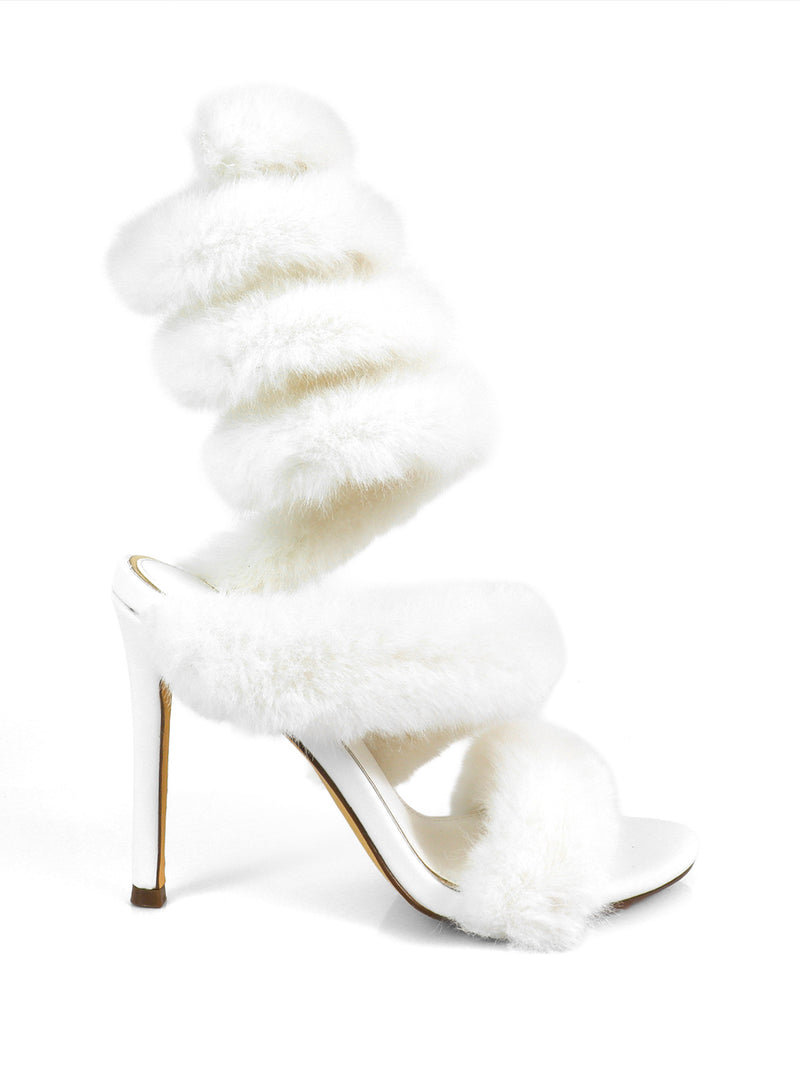 The Allure Fluffy Stiletto Sandal by Frederick's of Hollywood features plush faux fur straps, including a dramatic spiral ankle wrap, with a sleek open toe and high stiletto heel for an elegant statement look.