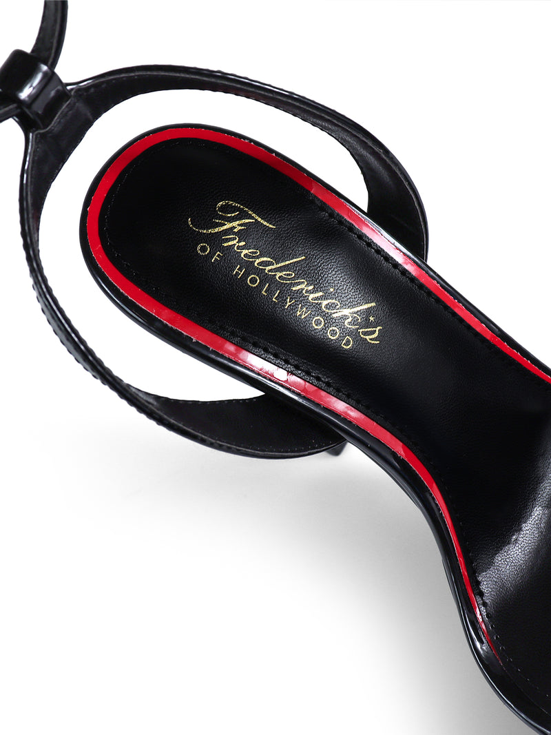 Close-up of Frederick's of Hollywood Cupid Strap Platform Heels—black platform sandals with red trim and gold Frederick's of Hollywood text on the insole, photographed on a white background.