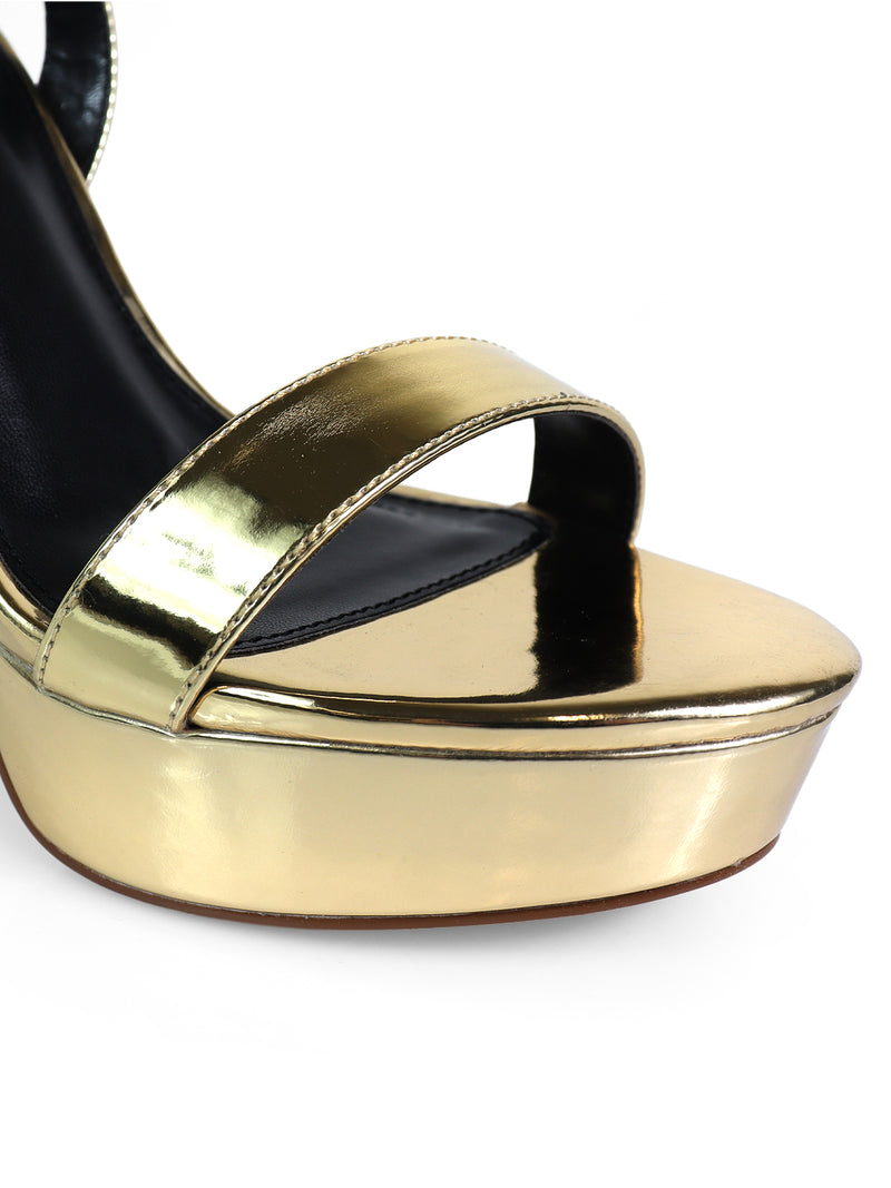 Close-up of Frederick's of Hollywood Cupid Strap Platform Heels—shiny gold with a single metallic toe strap, black insole, strap detailing, and an elevated glossy platform silhouette.