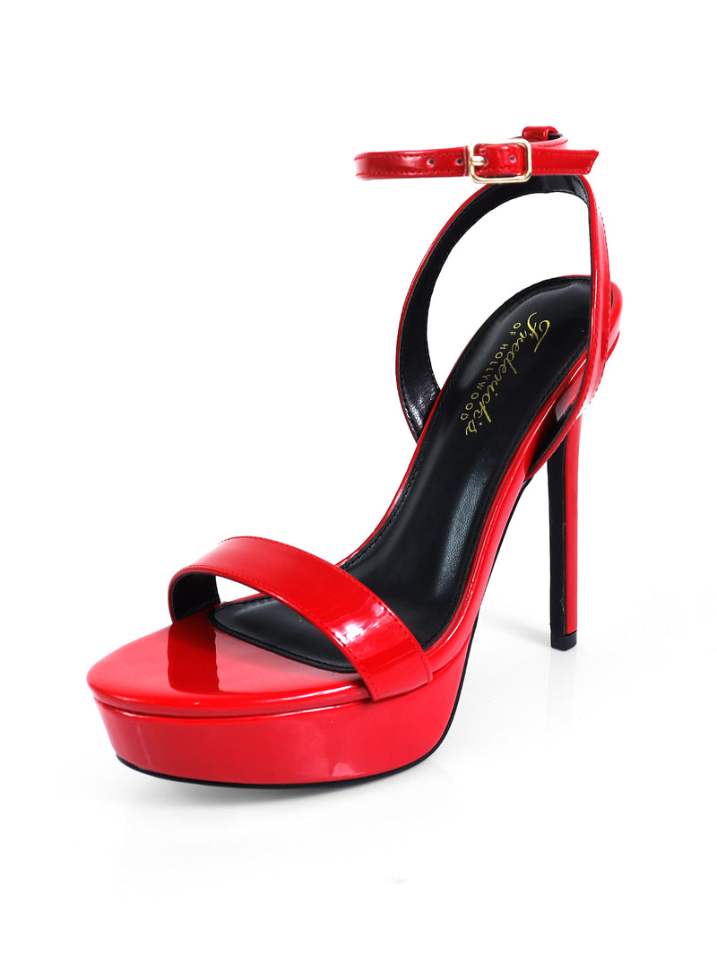 The Cupid Strap Platform Heels by Frederick's of Hollywood feature a glossy red finish, ankle strap, open toe, black insole, and chic strap detailing for an elevated silhouette.