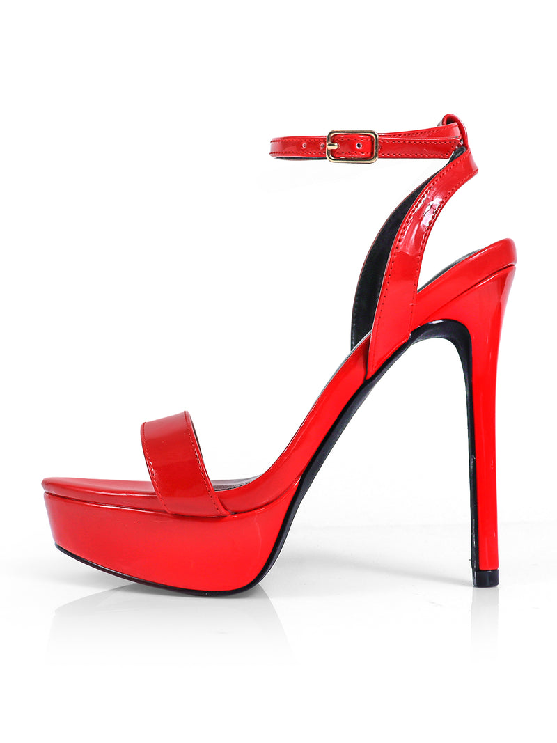 The Cupid Strap Platform Heels by Frederick's of Hollywood are shiny red high-heeled sandals with strap details, an ankle strap with buckle, and open toe design, featuring a glossy finish—all shown against a white background.