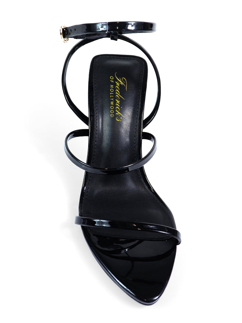The Cynthia Pointy Toe Pencil Heel by Frederick's of Hollywood is a black patent leather sandal with three thin straps, an ankle buckle, a striking pencil heel, and gold "Frederick's of Hollywood" detailing on the insole.