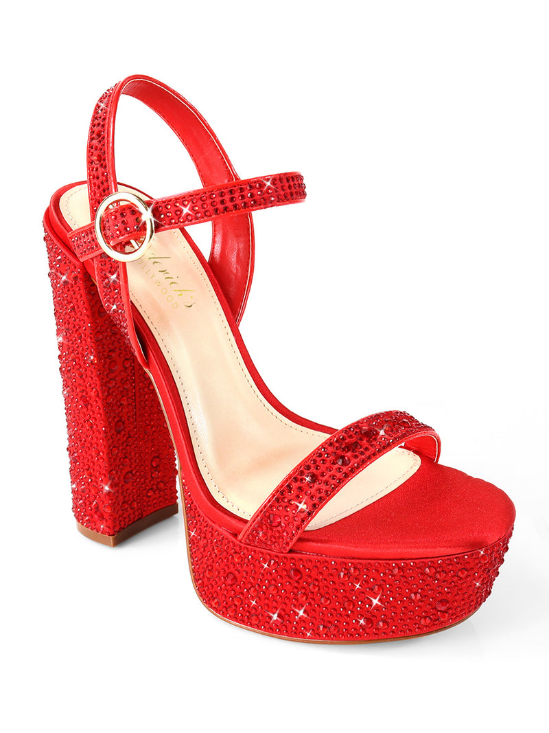 The Fabiosa Rhinestone Open Toe Platform Heel by Frederick's of Hollywood features sparkling rhinestones on the straps, heel, and platform plus a gold-buckle ankle strap—ideal for glamorous evening wear.