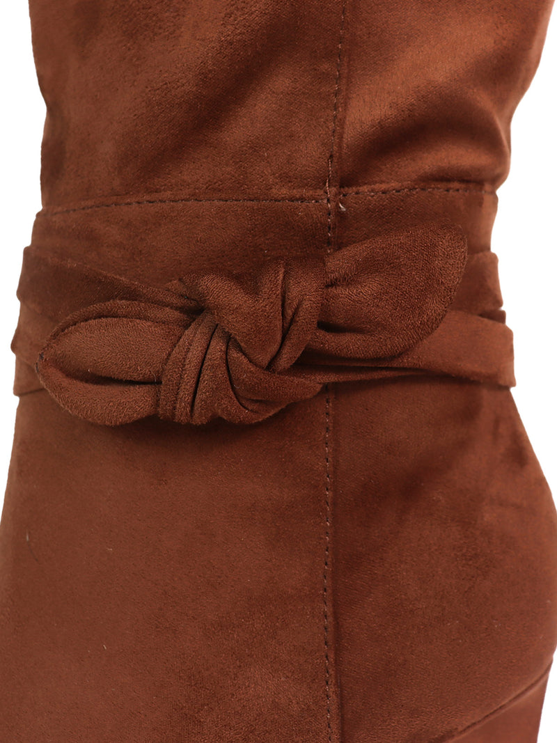 Close-up of a brown suede garment showcasing a fabric belt tied in a simple knot at the waist, highlighting its rich texture and stitching details—perfectly complemented by the Janeth Ankle Heel Boots from Frederick's of Hollywood.
