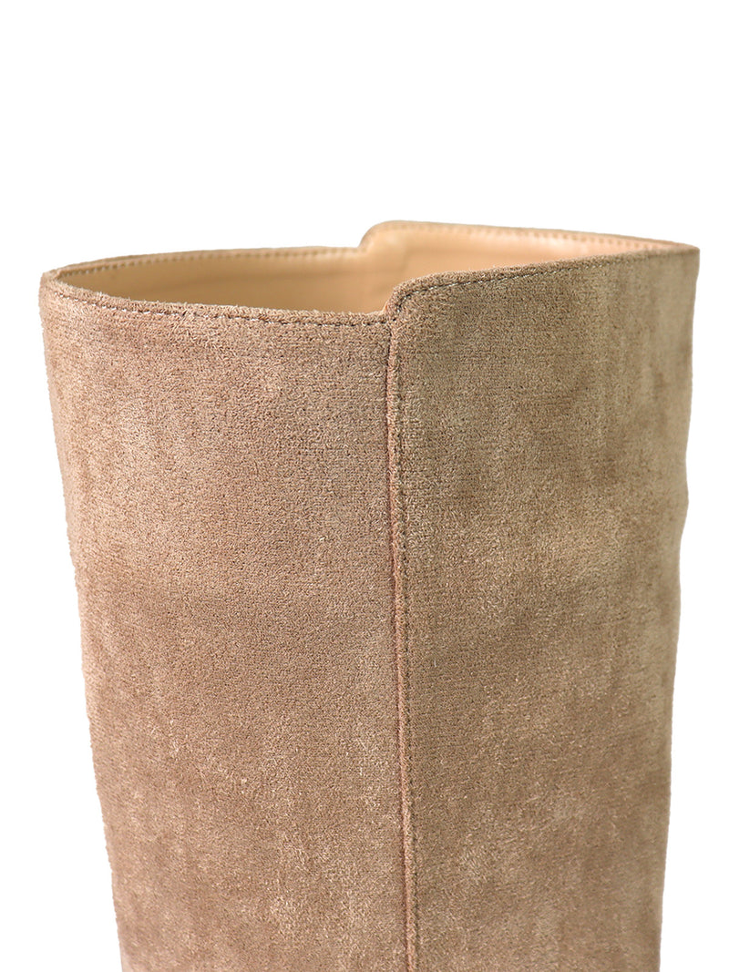 Close-up of the upper section of the Janeth Ankle Heel Boot by Frederick's of Hollywood, showcasing its tan suede material with visible stitching and a distinctive notch at the top. The interior lining and soft texture are also evident, highlighting the refined craftsmanship characteristic of these suede ankle boots.