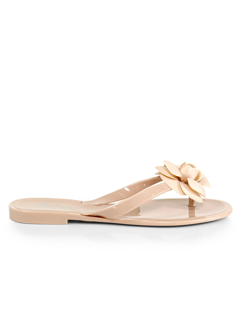 The Jelli Camellia Thong Sandals by Frederick's of Hollywood feature a large camellia detail, glossy beige finish, and open toe‚Äîperfect for warm-weather looks.