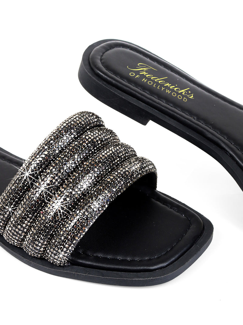 The Jennifer Rhinestone Slide Sandals by Frederick's of Hollywood feature thick, sparkling black straps, a cushioned footbed, and gold brand lettering on the insole for a glamorous slip-on style.