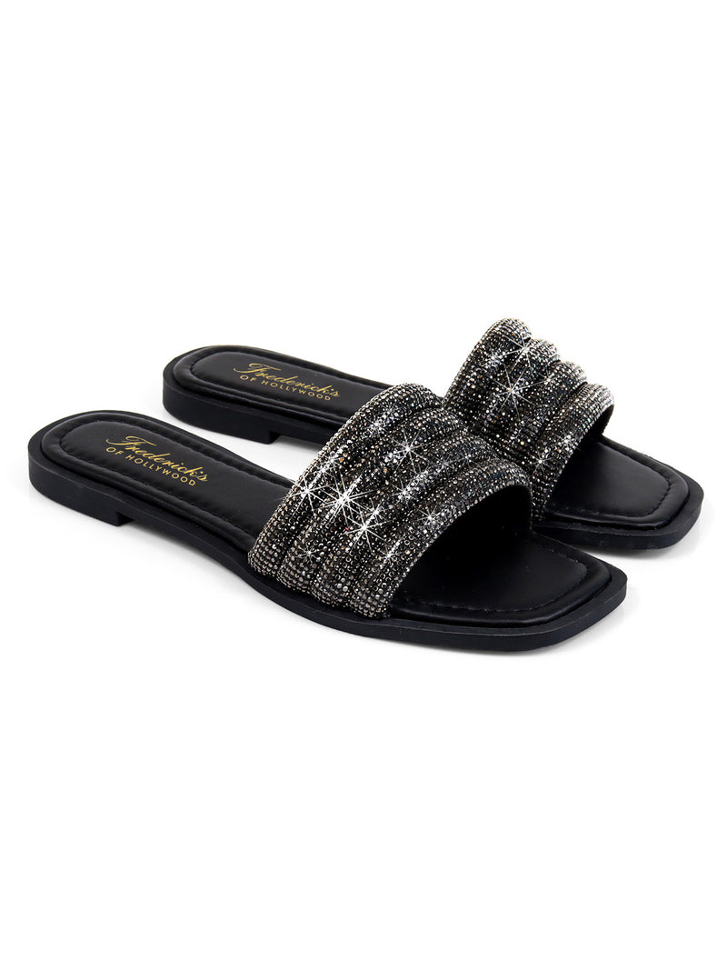 The Jennifer Rhinestone Slide Sandals by Frederick's of Hollywood are black, open-toe slides featuring wide, rhinestone-embellished straps, shown on a white background.