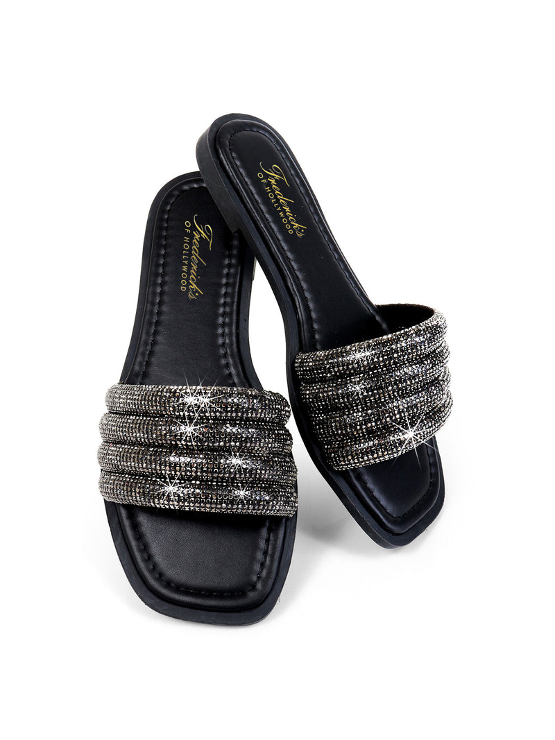 The Jennifer Rhinestone Slide Sandals by Frederick's of Hollywood feature wide, sparkling silver rhinestone straps and a square toe in black, with one sandal slightly overlapping the other on a white background.