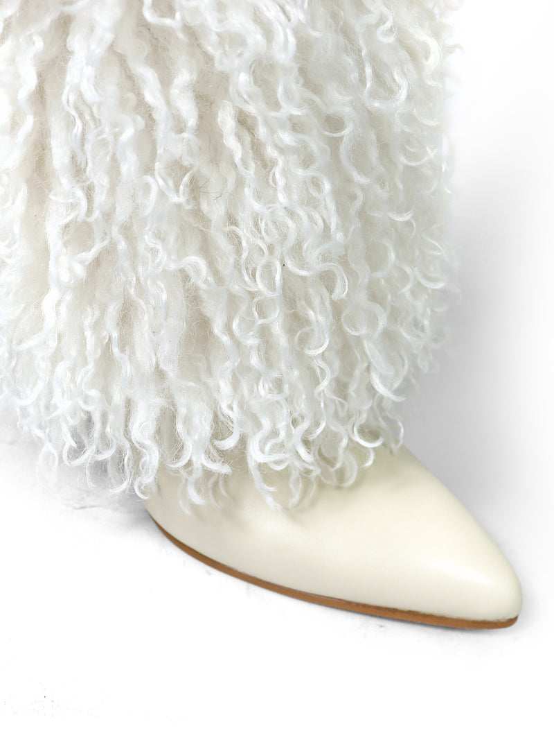 A close-up of the Kiki Pointed Toe Fluffy Boot by Frederick's of Hollywood, featuring a white pointed toe and plush, faux fur-like fabric for a chic, fashion-forward style.