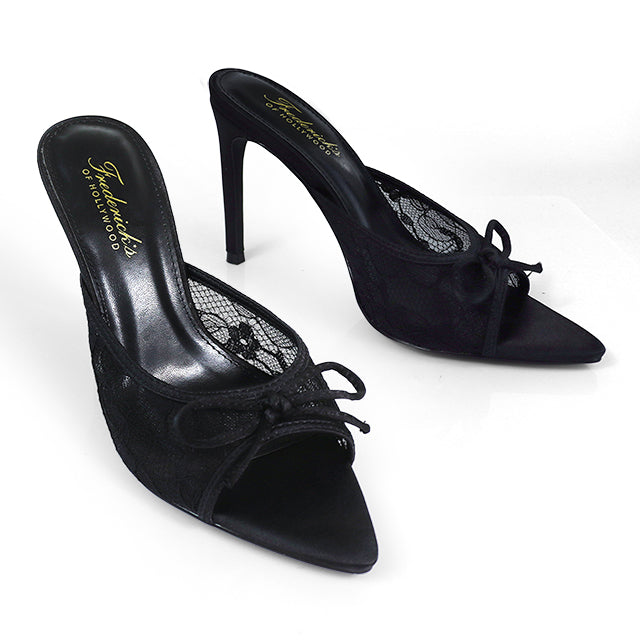 The Lacey Pointed Toe Lace Bow Heels by Frederick's of Hollywood are black heels with lace detailing, a stylish front bow, and gold-branded insoles.