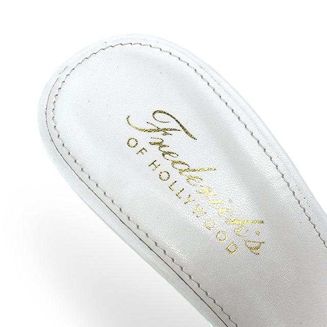 Close-up of a white insole with gold “Frederick's of Hollywood” text, designed for Una Metal Toe Cap Thigh High Boots. Visible stitching lines the edge.