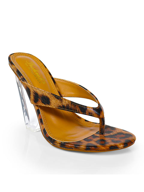 The Leila Thong Heels by Frederick's of Hollywood are stylish women's sandals featuring a leopard print, two thin straps, a tan footbed, and modern clear wedge heels.