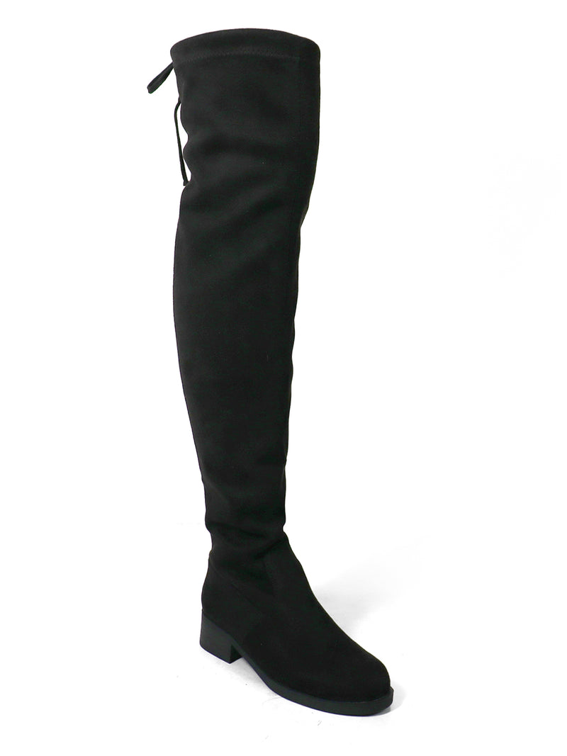 The Letizia Thigh High Super Stretch Boot by Frederick's of Hollywood is featured here as a single black boot with a low block heel and a slightly pointed toe, offering statement-making style against a white background.