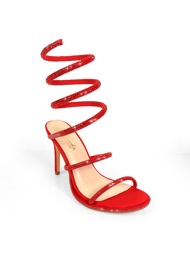 The Lexia Rhinestone Heel by Frederick's of Hollywood is a red open-toe stiletto sandal with three slim foot straps, a long spiraling leg strap, textured shiny finish, and dazzling sparkly heels.