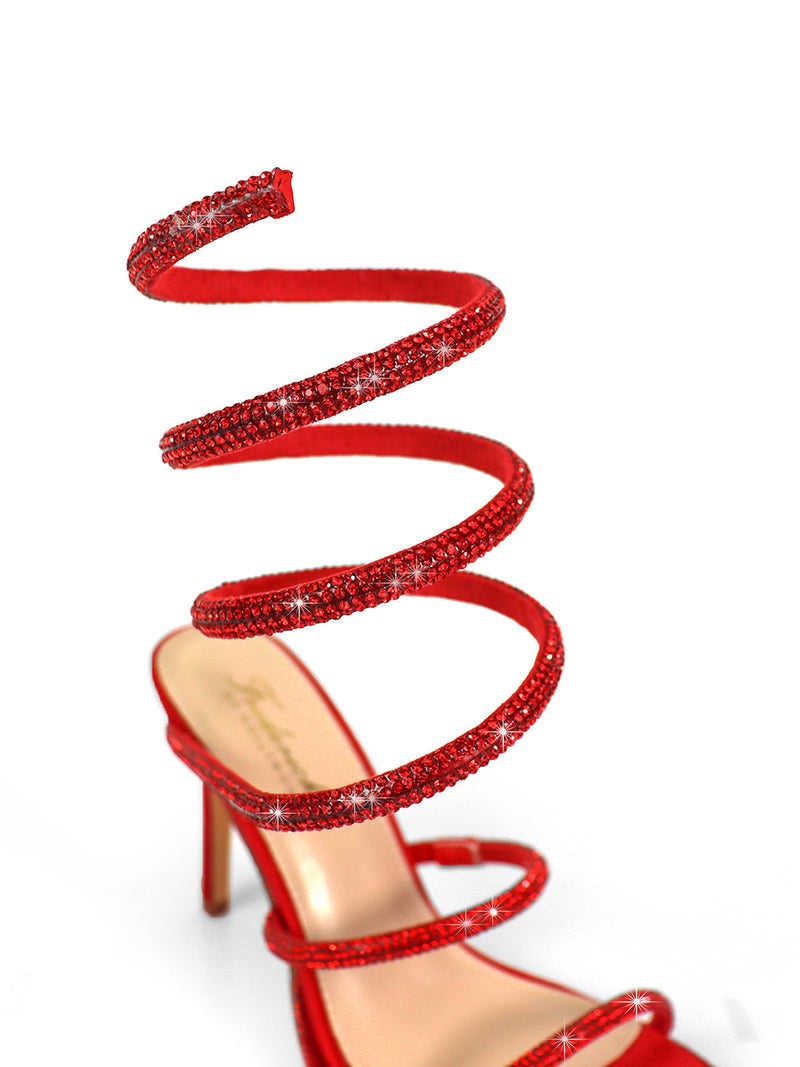 The Lexia Rhinestone Heel by Frederick's of Hollywood features a red open-toe stiletto with sparkling rhinestone spiral straps, creating a glamorous statement. Photographed against a white background.