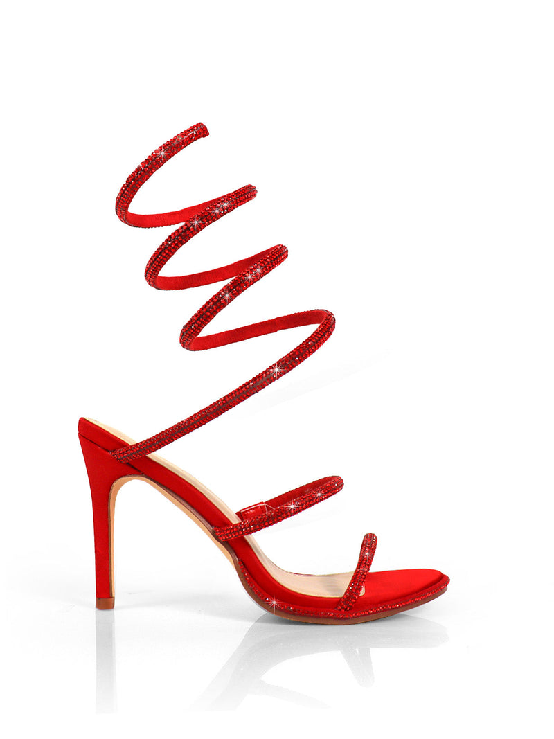 The Lexia Rhinestone Heel by Frederick's of Hollywood is a red open-toe stiletto sandal with three slim foot straps and long rhinestone spiral ankle straps, adorned with sparkling embellishments, shown on a white background.