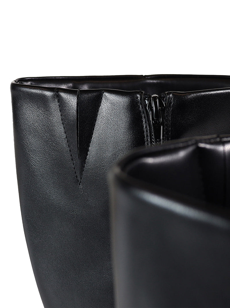 Close-up of the top edges and zipper on two Paola Knee High Boots by Frederick's of Hollywood, highlighting their smooth black finish and subtle stitching details against a white background.